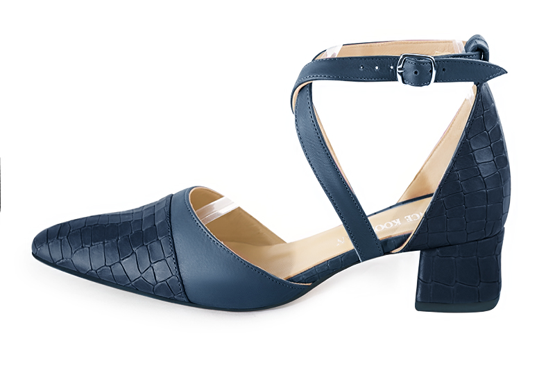 Denim blue women's open side shoes, with crossed straps. Tapered toe. Low flare heels. Profile view - Florence KOOIJMAN